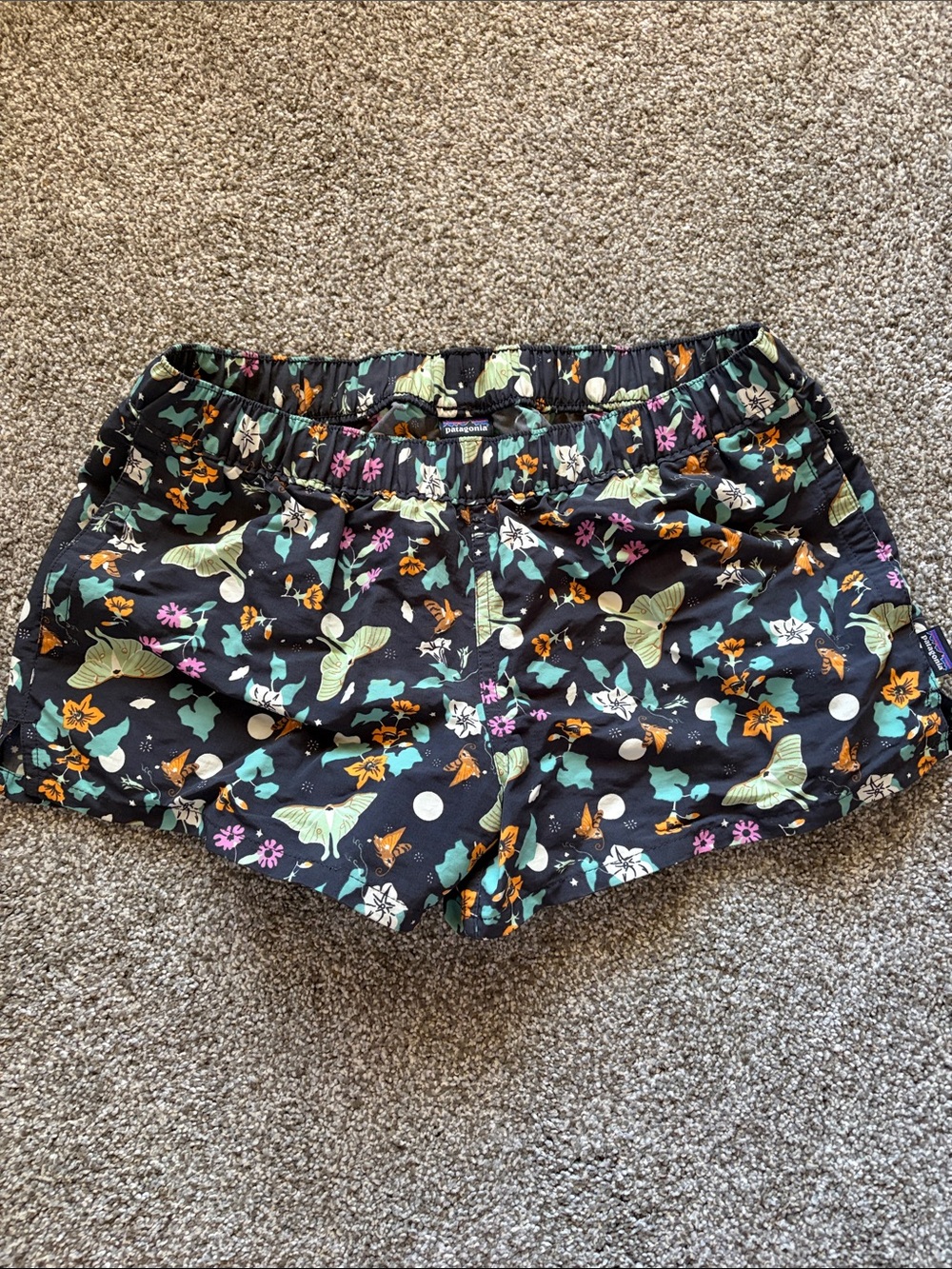 Patagonia Black Floral Athletic Shorts with Green and Orange Accents